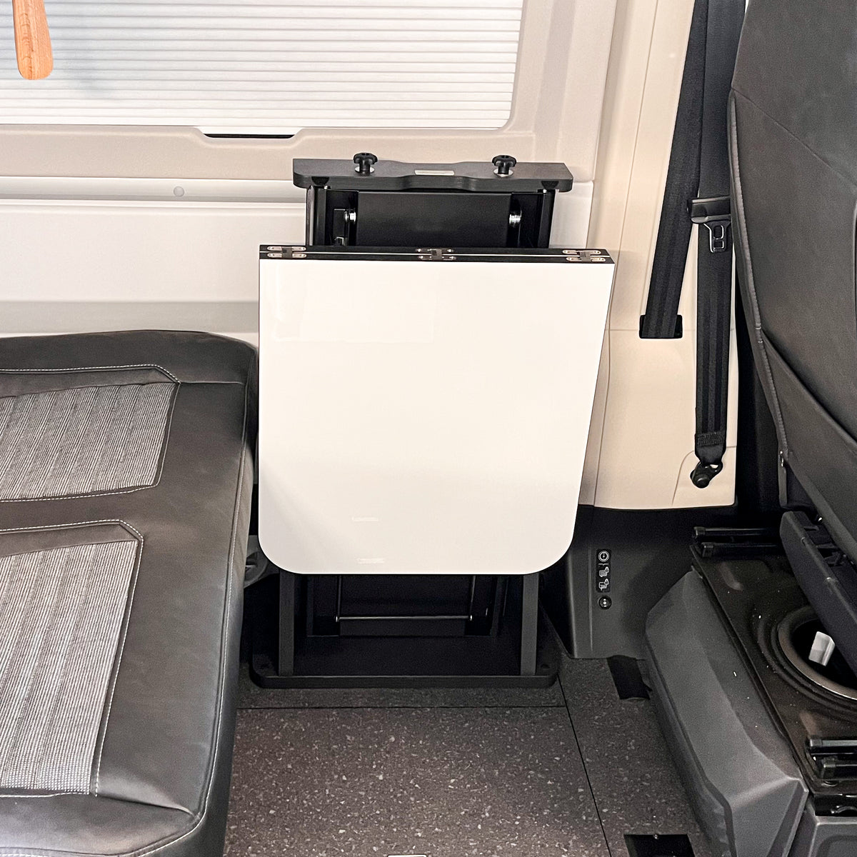 Floating table for panel vans and campervans