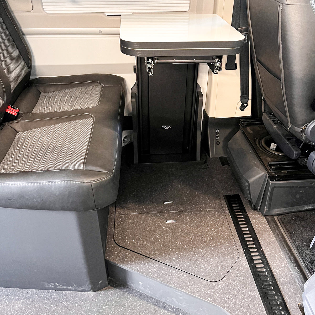 Floating table for panel vans and campervans